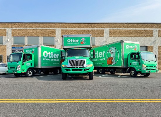 Otter Moving truck fleet — van and three trucks