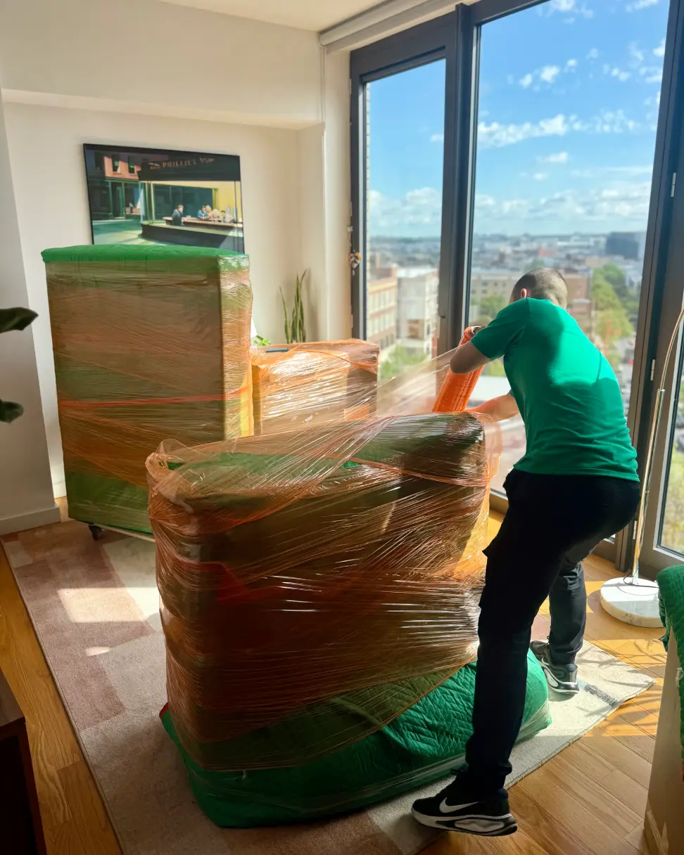 Otter Moving & Storage packers packing an NYC apartment